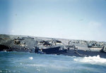 LCMs broached in the surf (the left most one was from USS Belle Grove LSD-2) and LVTs and other vehicles on Blue Beach, Iwo Jima, Japan, circa late Feb 1945