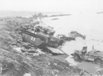 Wrecked LVT and other vehicles on the shores of Iwo Jima, Japan, 1945