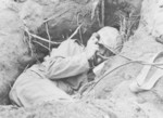 US Marine field telephone operator in a foxhole, Iwo Jima, Japan, 1945