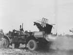 US Marine mobile rocket launcher, Iwo Jima, Japan, 1945. Note two 3-inch rockets laying on the ground.