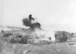 An explosion on Iwo Jima, Japan, 1945. Note two M-3 Halftrack personnel carriers.