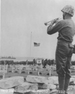 US Marine playing taps at the American cemetery on Iwo Jima, Japan, 1945