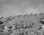 Men of USMC 5th Division advancing through the volcanic ash hills of Red Beach No. 1 at Iwo Jima, Japan, 19 Feb 1945, photo 1 of 2