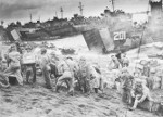 US Coast Guard and Navy personnel unloading supplies on the beaches of Iwo Jima, Japan, 19-20 Feb 1945