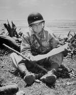 Marine Major General Lemuel Shepherd of the 6th Marine Division studied a map on Okinawa, Jun 1945