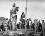 Flag-raising ceremonies at US Marine Headquarters on Iwo Jima, Mar 1945