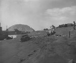 Iwo Jima landing beach, cluttered with abandoned vehicles and other debris, circa late Feb 1945