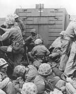 Marines crouched in a Coast Guard-manned LCVP on the way in on the first wave to hit the beach at Iwo Jima, 19 Feb 1945, photo 2 of 2