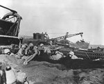 US Marines digging in on a beach at Iwo Jima, Japan, 21 Feb 1945, photo 1 of 2