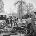 Men digging drainage ditches by the mess hall of Block 7 of Jerome War Relocation Center, Arkansas, United States, 16 Nov 1942, photo 2 of 2