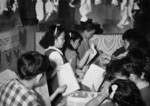 Fourth grade Japanese-American children at a cooperative store stand selling valentines, Jerome War Relocation Center, Arkansas, United States, Feb 1944, photo 3 of 3