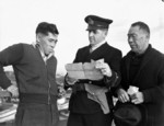 Royal Canadian Navy officer questioning Japanese-Canadian fishermen, 9 Dec 1941