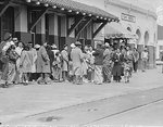 Japanese-Americans waiting for the train which would take them to a relocation center, California, United States, 5 Apr 1942