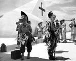 Aboard two Mitsubishi G4M ‘Betty’ bombers in surrender markings, a Japanese delegation stopped at Ie Jima, Ryukyu Islands en route Manila, Philippines for a surrender briefing, 19 Aug 1945. Photo 07 of 12.