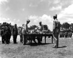 Lieutenant General Stilwell accepted Japanese surrender at US Tenth Army Headquarters, Okinawa, 7 Sep 1945. Note Japanese commander Lt General Toshiro Nomi at left in pith helmet.