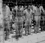 Japanese POWs at Guam bowed their heads after hearing Emperor Showa