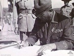 Lt. Gen. K. Yamada of Japanese 48th Division signing the instrument of surrender for all Japanese forces in the Lesser Sundas, Koepang, Timor, 3 Oct 1945, photo 1 of 3