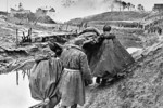 Soviet soldiers carrying a wounded comrade at Neva Dubrovka, near Leningrad, Russia, date unknown