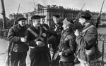 Militia/workers of the Kirov Factory and Soviet naval infantrymen on a bridge near the factory, Leningrad, Russia, 1 Apr 1942