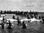 US Marines wading toward Tinian from amphibious tractors and landing boats, Mariana Islands, 25 Jul 1944, photo 3 of 3