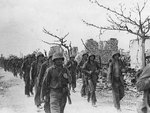 US Marines marching through Garapan, Saipan, Mariana Islands, 6 Jul 1944