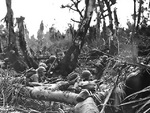 US Marines taking position behind cover, Saipan, Mariana Islands, Jun 1944