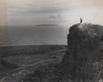 A US Marine standing at the edge of a cliff on Tinian, Mariana Islands, 1944