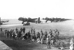 British men of 3rd Platoon, 21st Independent Parachute Company at Fairford, Gloucestershire, England, United Kingdom for Operation Market I, 17 Sep 1944; note background Stirling Mark IV aircraft of 6
