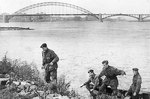 British Royal Engineers 1st Para Squadron Cpl John Humphreys, Cpl Charles Weir, Lt Dennis Simpson, Cpt Eric Mackay at Nijmegen, Holland, recreating their escape from German captivity, 23 Sep 1944