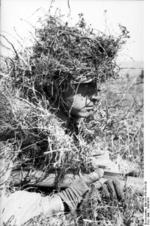 Camouflaged German paratrooper at Monte Cassino, Italy, 1943-1944