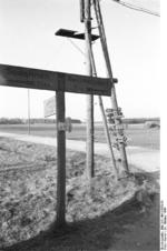 Road sign near Nemmersdorf, East Prussia, Germany, late Oct 1944, photo 2 of 2