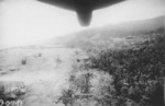 US B-25 bombers dropping parafrag bombs over a Japanese airfield at Cape Gloucester, New Britain, 1943