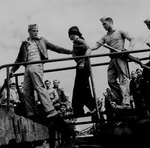 US Marines unloading Japanese prisoner of war from a submarine, May 1945