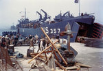 LST-357 loading vehicles in an English port, in preparation for the invasion of France, circa late May or early Jun 1944
