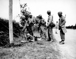 African-American soldiers of the US Army bring taught how to detect and disarm mines, France, 13 Jul 1944