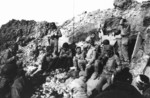 US Army soldiers resting at Pointe du Hoc, Normandy, France, 6 Jun 1944