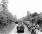 US Army soldiers and jeeps on their way to the front lines, Saint-Lô, France, Jul 1944