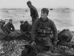 US Army soldiers recovering remains of comrades at Omaha Beach, Normandy, France, 6 Jun 1944