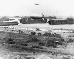 LSTs landing vehicles and cargo on a Normandy beach, June 1944, photo 2 of 2