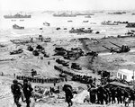 Reinforcements of men and equipment moving inland at Omaha Beach, Normandy, 8 Jun 1944