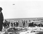 Newly landed US troops moved along Utah Beach at Les Dunes de Madeleine, Normandy, 12 Jun 1944