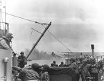 Troops and vehicles on board a landing craft approaching Omaha Beach, Normandy, 6 Jun 1944
