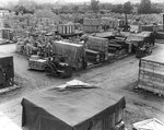Tractors hauled supplies around an overflow materiel yard in England, which held supplies exceeding the capacity of Normandy yards, 28 Jul 1944