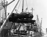 An American locomotive was transferred from SS Seatrain Texas, Cherbourg, 13 Jul 1944, to replace one of the many destroyed during the Allied invasion of Normandy, photo 2 of 2