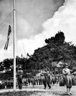 Raising the US flag on Okinawa, Japan, 22 Jun 1945