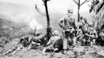 Men of the US 6th Marine Division observing shelling of a Japanese position near Yae Take Airfield, Okinawa, Japan, 14 Apr 1945