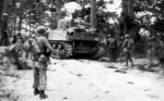 Men and M4 Sherman tank of the 382nd Infantry Regiment, US 96th Division on the Ginowan Road, Okinawa, Japan, circa Apr-Jun 1945