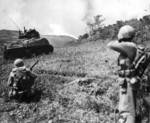 US Marine flamethrower and rifle squad attacking a Japanese position on Okinawa, Japan, 11 May 1945