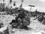 Lieutenant Colonel R. G. Balance of US 1st Marine Division at the shore party command post, Peleliu, Palau Islands, Sep 1944; note treated shrapnel wound on his left cheek