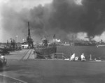 View of Pearl Harbor Navy Yard from the submarine base, Oahu, US Territory of Hawaii, 7 Dec 1941, photo 2 of 2; USS Narwhal at left and various ships in background